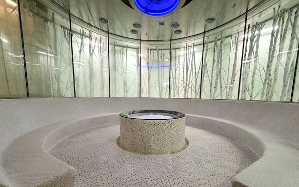 Circular sauna room with central stone feature at Aqua field, VinPearl Harbour, Nha Trang, Vietnam.