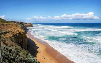 Great Ocean Road coastline with waves and cliffs, Melbourne tour.