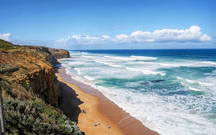 Great Ocean Road coastline with waves and cliffs, Melbourne tour.