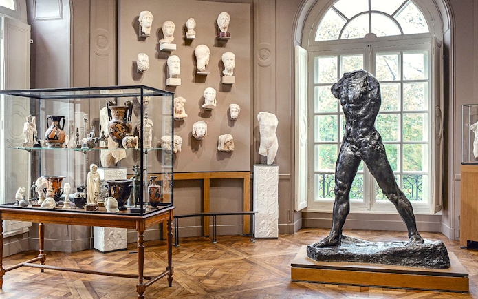 Rodin Museum interior with sculptures and artifacts display in Paris.