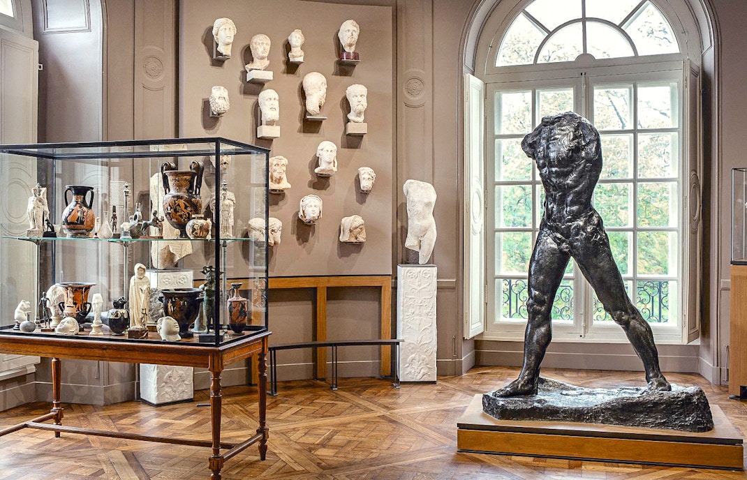 Rodin Museum interior with sculptures and artifacts display in Paris.