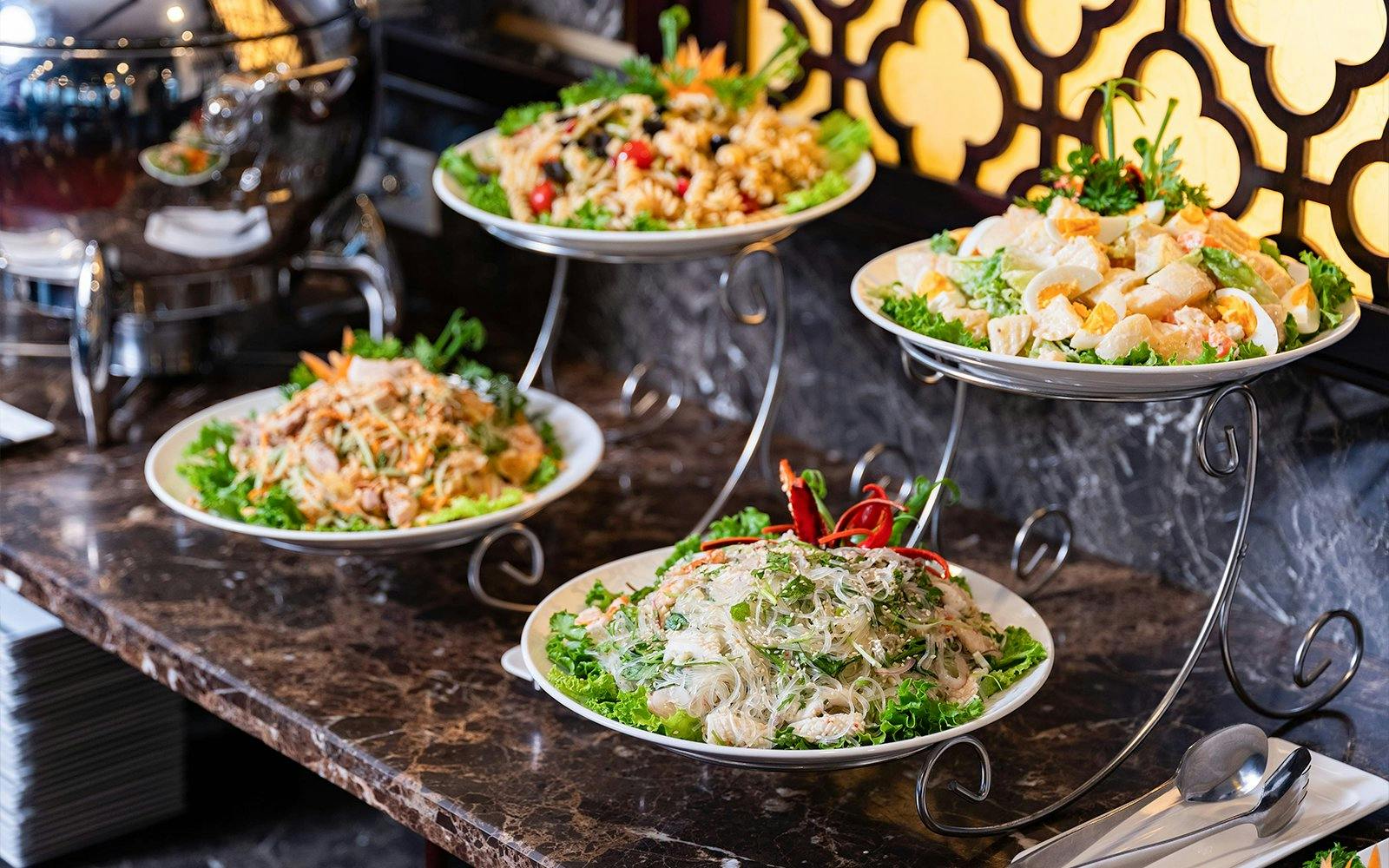 Buffet spread with salads and noodles on Amanda Luxury Cruise.