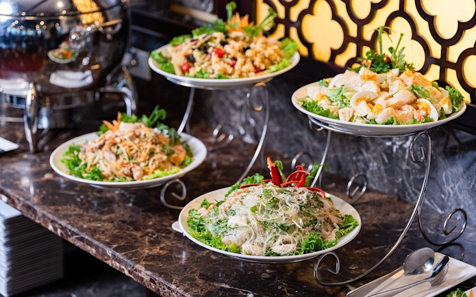 Buffet spread with salads and noodles on Amanda Luxury Cruise.