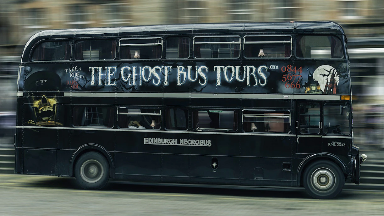 Edinburgh double-decker bus for Ghost Bus Tour with spooky artwork.