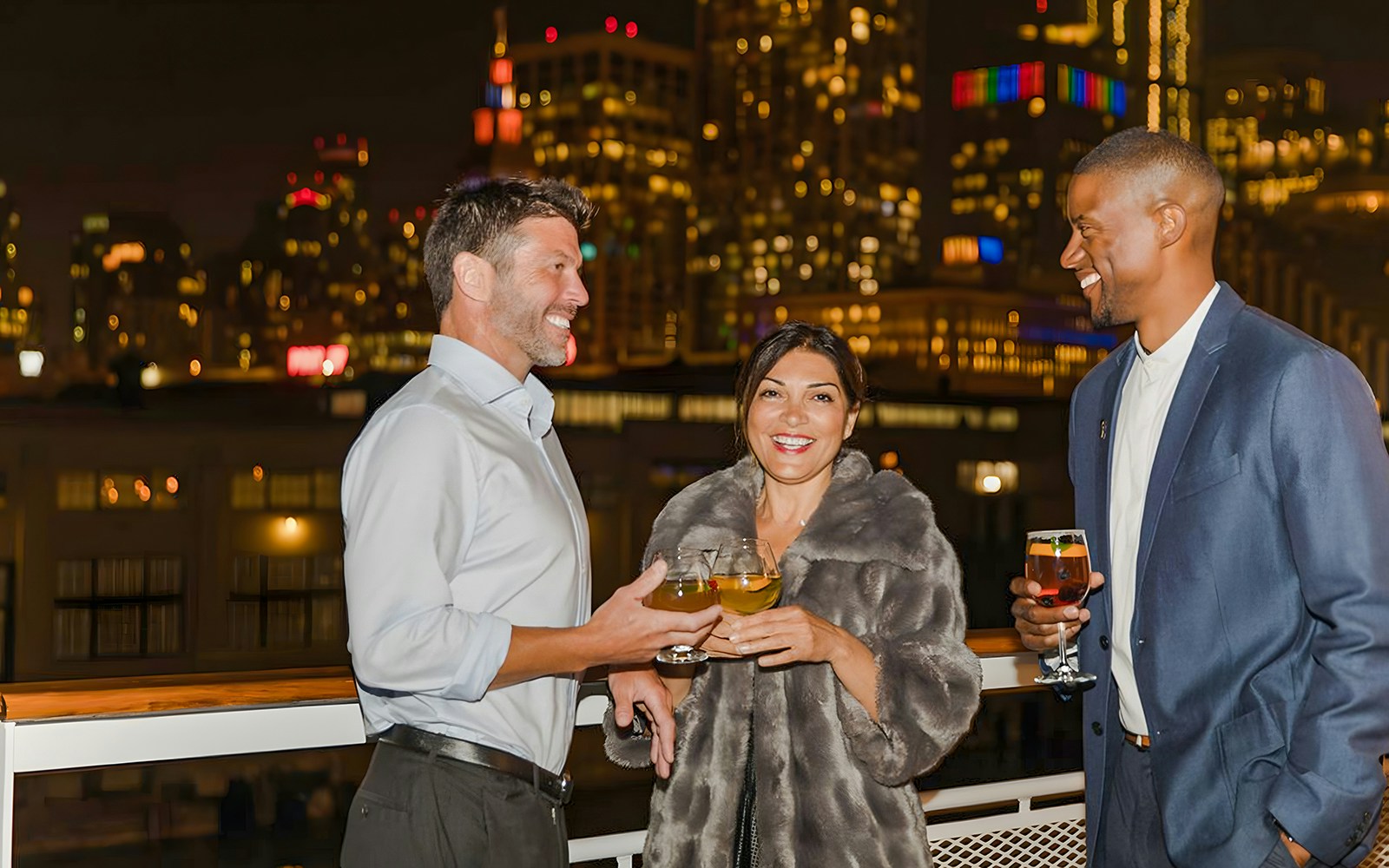 Friends enjoying wine and conversation on a New York City dining cruise.