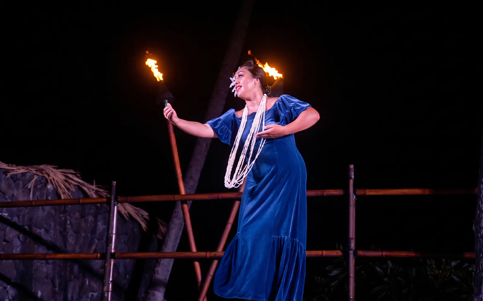 Lady performing with fire at Voyagers of the Pacific Luau.