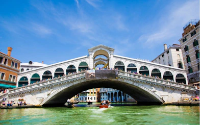 Rialto Bridge over Grand Canal in Venice, part of Casanova's self-guided city exploration game.