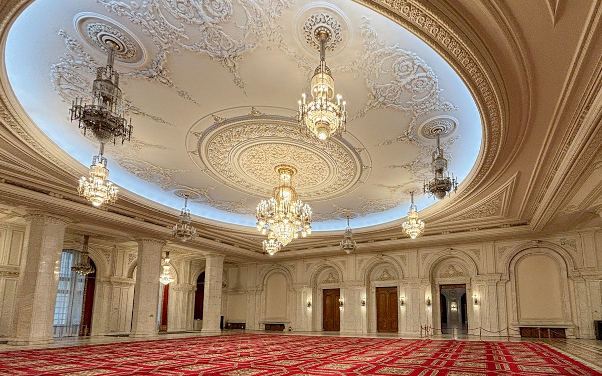 Palace of Parliament Bucharest, ornate chandeliers and detailed ceiling in Human Rights Hall.