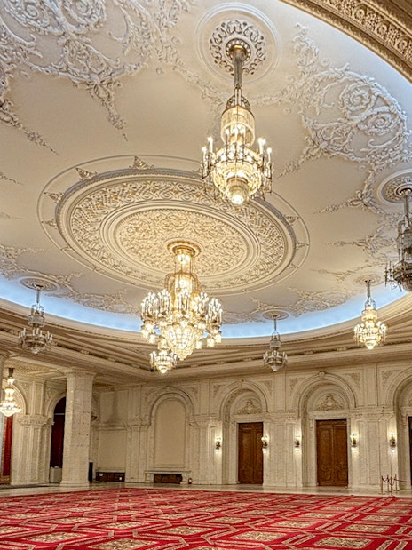 Palace of Parliament Bucharest, ornate chandeliers and detailed ceiling in Human Rights Hall.
