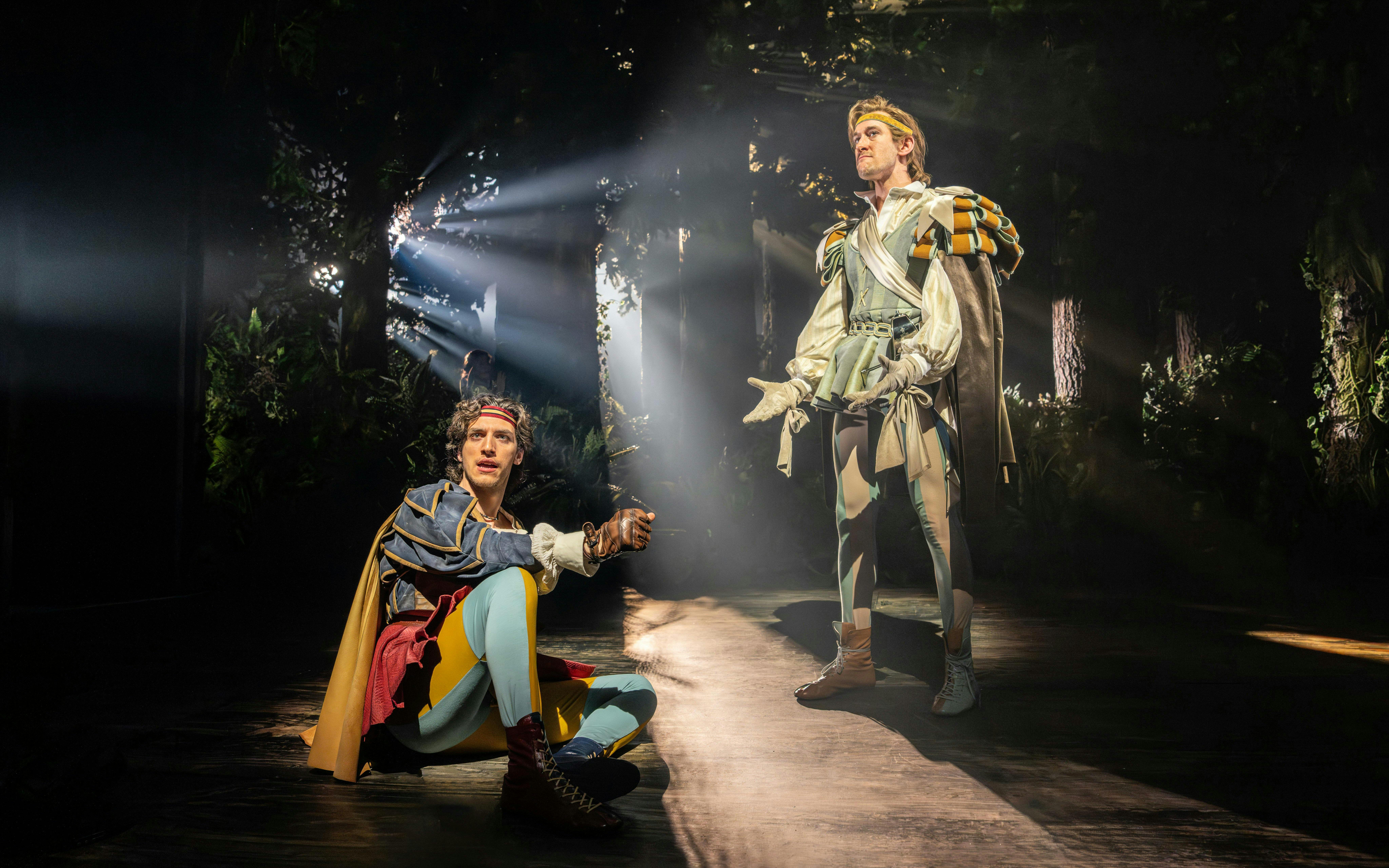 Actors performing in a forest scene from "Into The Woods" production.