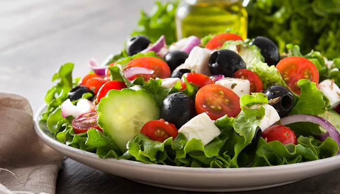 Greek salad with tomatoes, cucumbers, olives, and feta on Athens Original Vegan Tour.