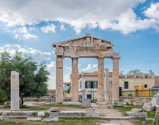 Roman Agora ruins with columns and gate in Athens, Greece.