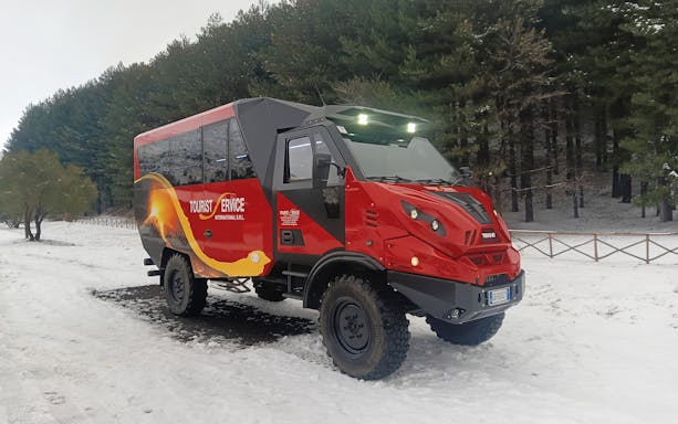 4x4 vehicle on snowy terrain during Mount Etna tour.