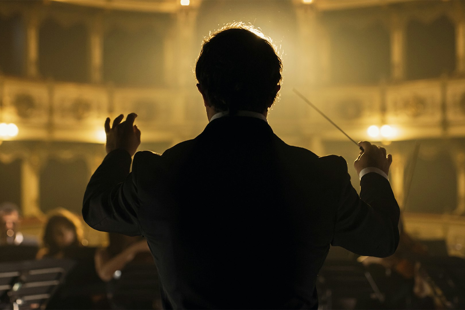 Conductor leading orchestra at Classic Ensemble Vienna Concert, St. Peter's Church.