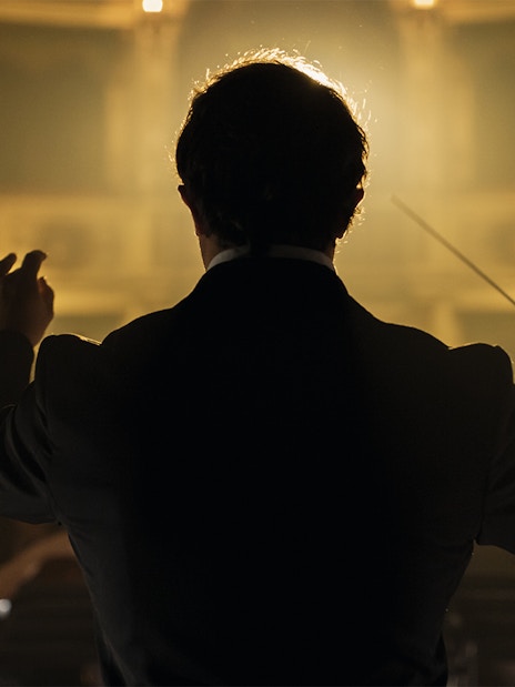 Conductor leading orchestra at Classic Ensemble Vienna Concert, St. Peter's Church.