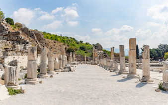 Ancient columns lining Stage Agora Street in Ephesus, Turkey.