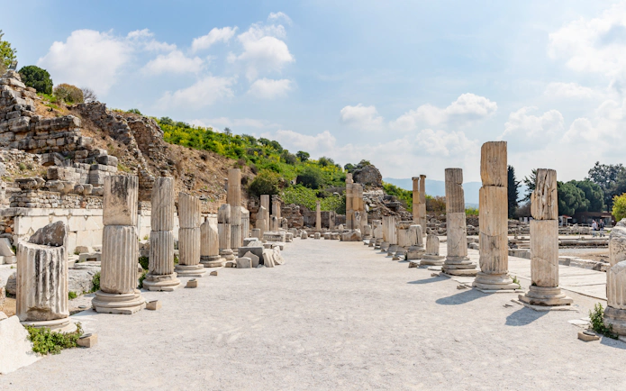 Ancient columns lining Stage Agora Street in Ephesus, Turkey.