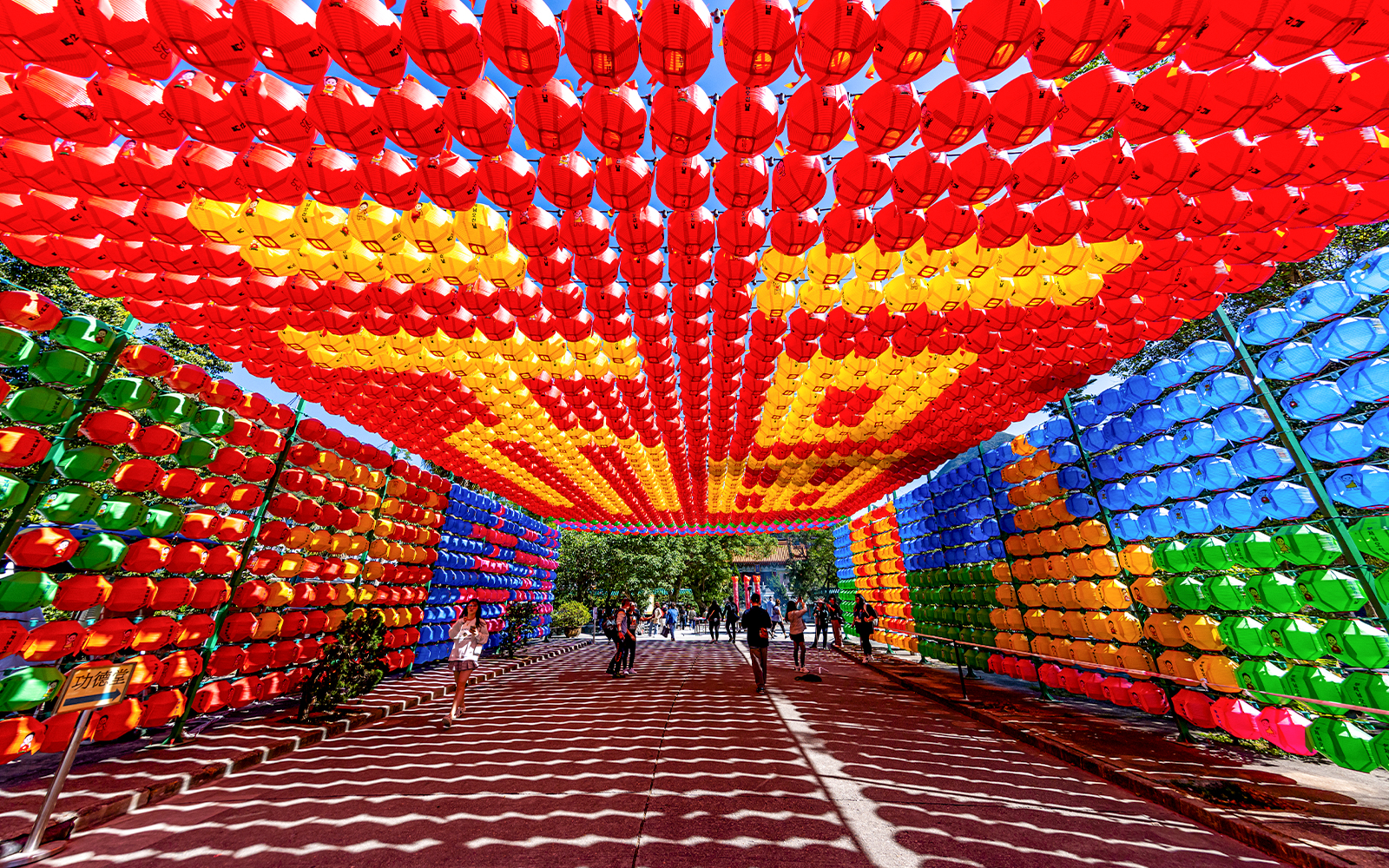 Colorful lantern tunnel in Tai O, Hong Kong, part of the 360 Tai O Pass experience.