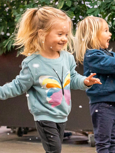 Children playing with bubbles at California Academy of Sciences.