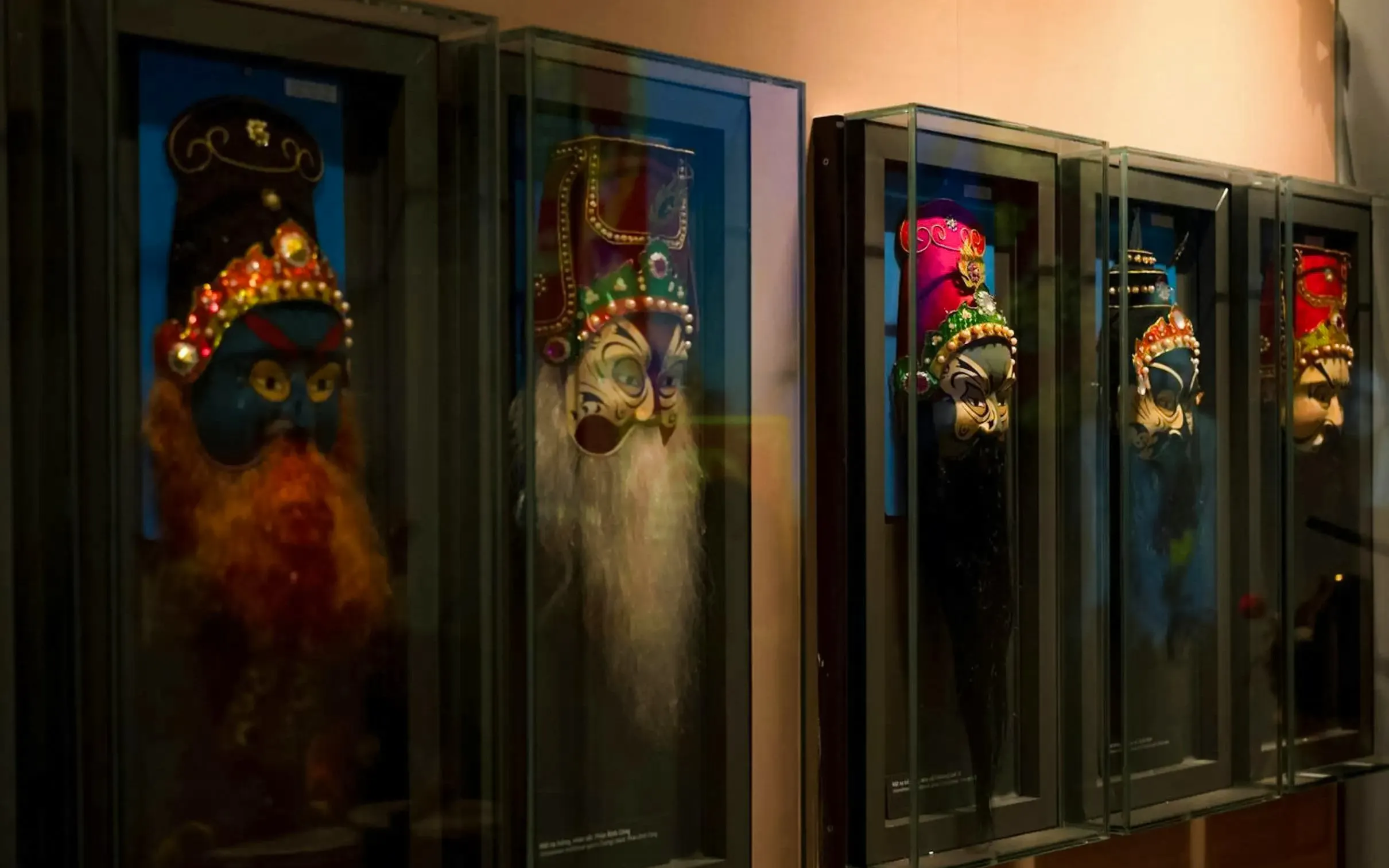 Traditional masks displayed in a museum exhibit in Da Nang, Vietnam.