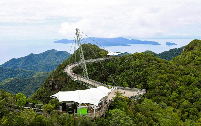 Langkawi Skybridge spanning lush forests with distant islands in view.