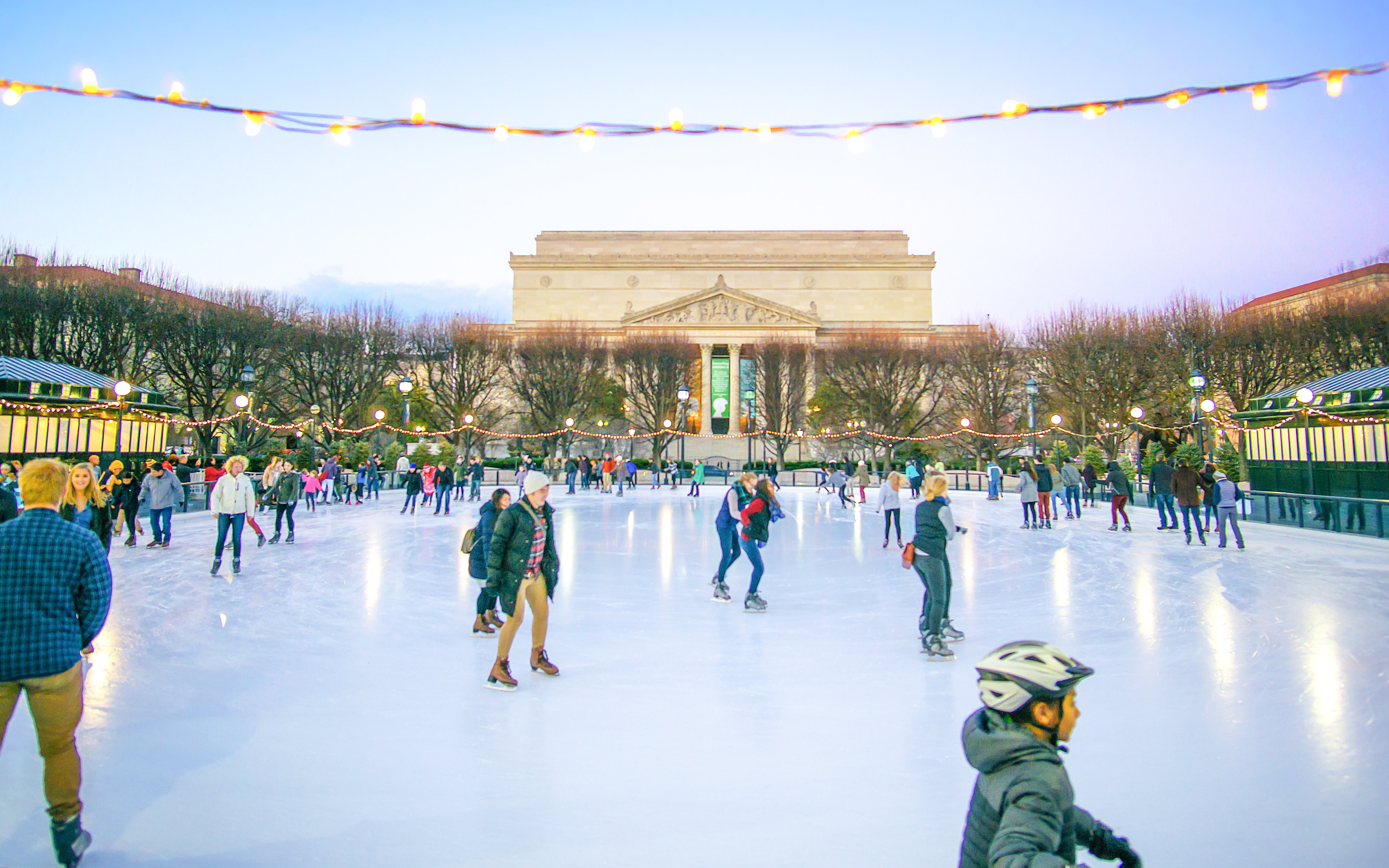 Skaters enjoying the ice rink at National Gallery of Art Sculpture Garden, Washington DC.