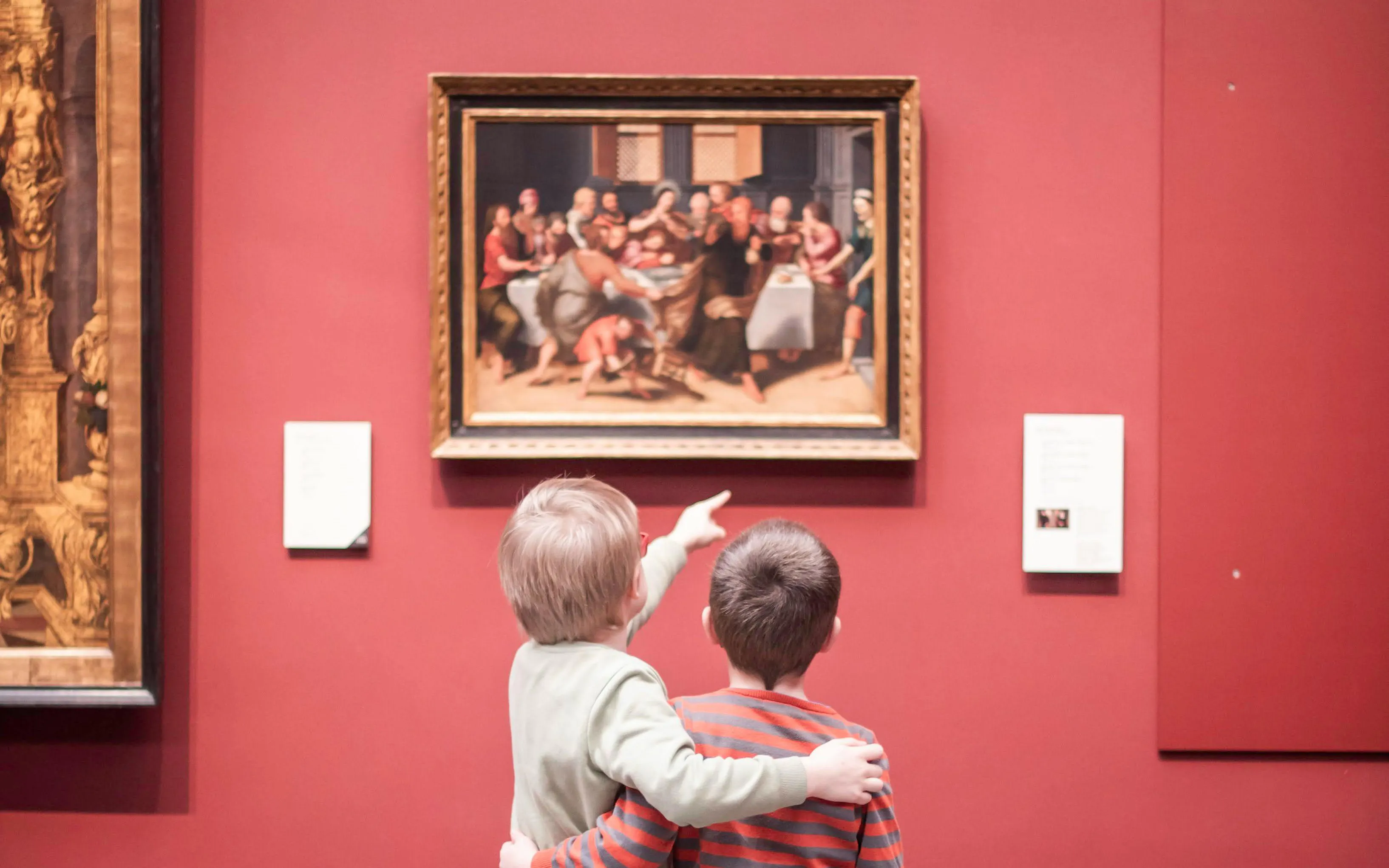 Children admiring a painting at Groeningemuseum in Bruges.