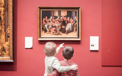 Children admiring a painting at Groeningemuseum in Bruges.