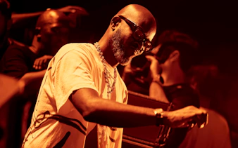DJ performing at UNVRS Ibiza nightclub event.