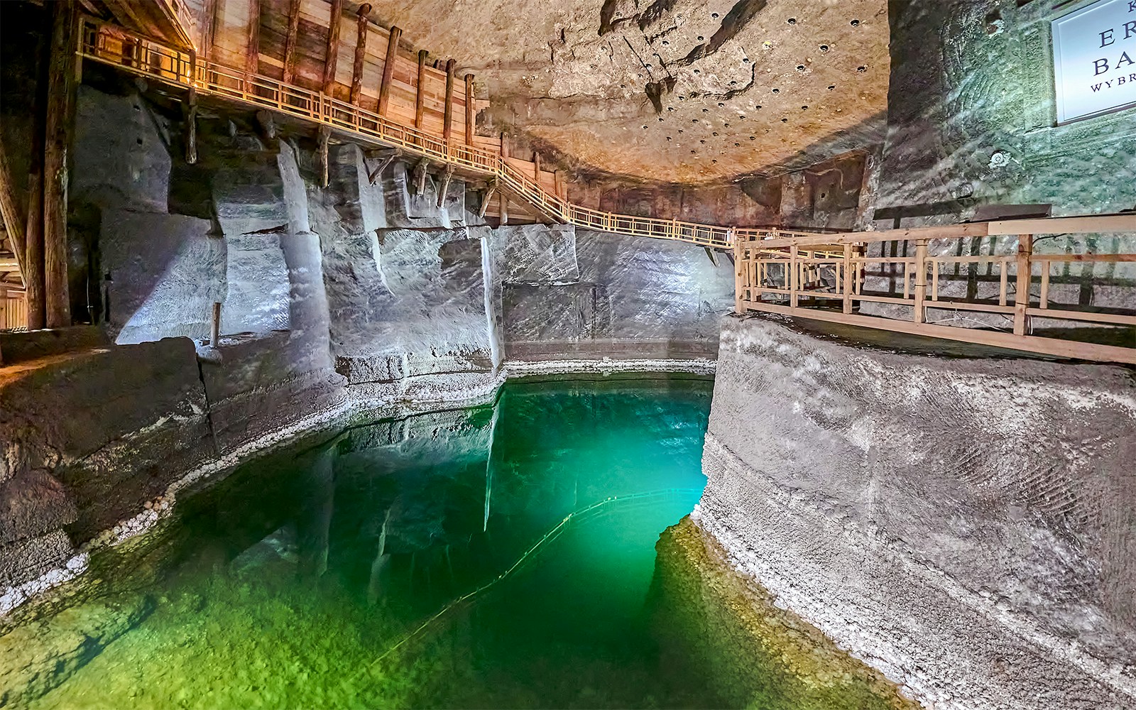 Underground lake with wooden walkways in Wieliczka Salt Mine, Poland.
