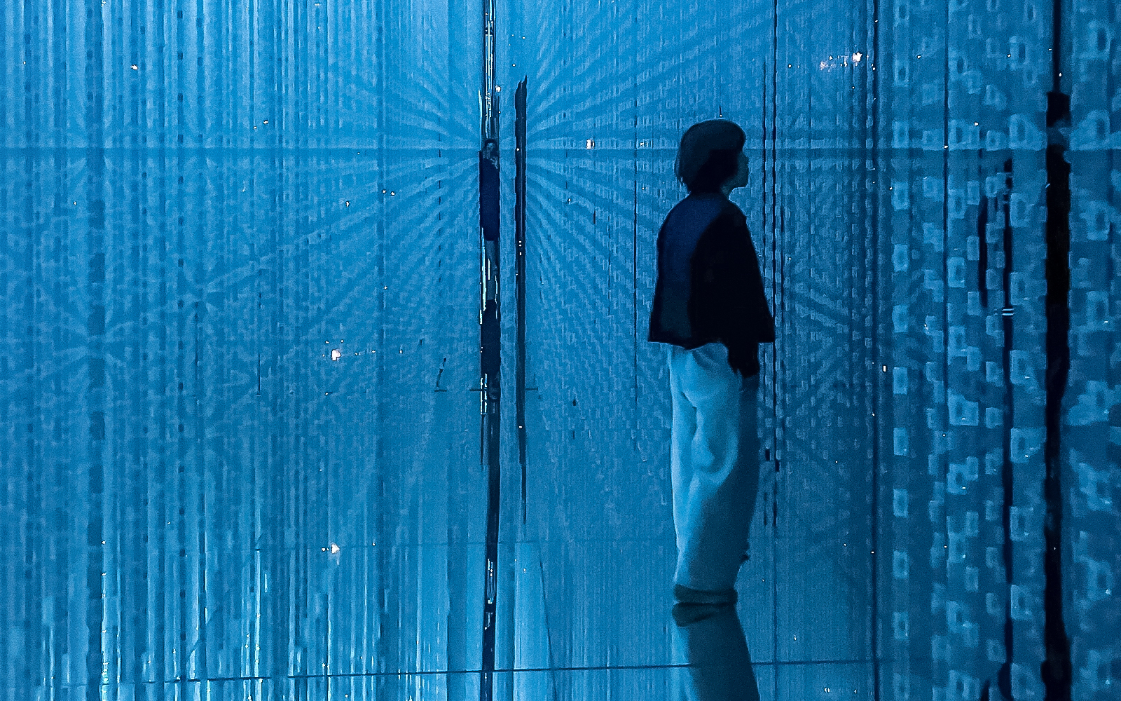 Visitors exploring the immersive digital art at teamLab Planets exhibit in Tokyo