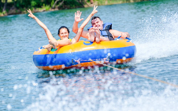 People enjoying tubing on the water at Côte Est de l'île Maurice.