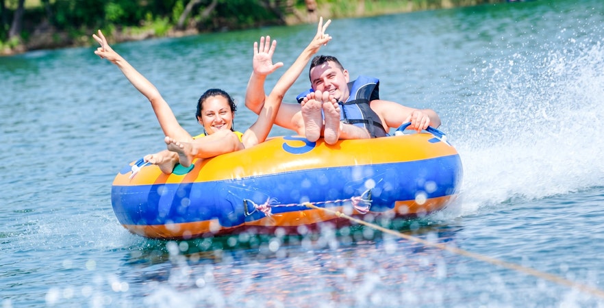 People enjoying tubing on the water at Côte Est de l'île Maurice.