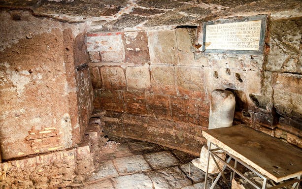 Carcere Mamertino cell interior with stone walls and inscription, Rome.