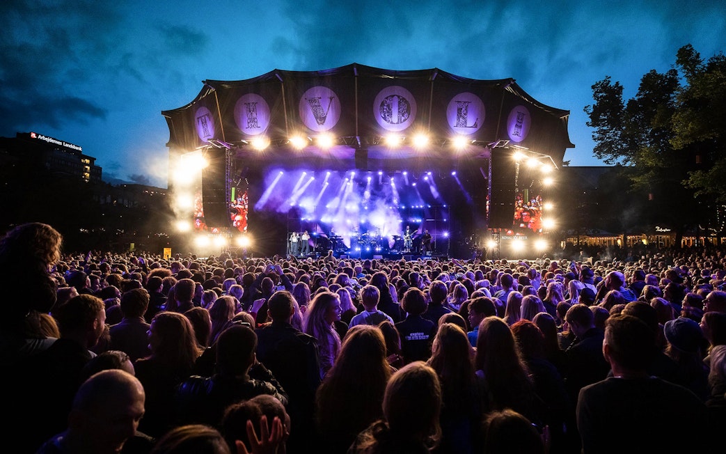 Crowd enjoying a live concert at Tivoli Gardens, Copenhagen.