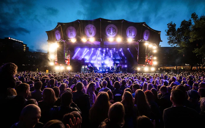 Crowd enjoying a live concert at Tivoli Gardens, Copenhagen.