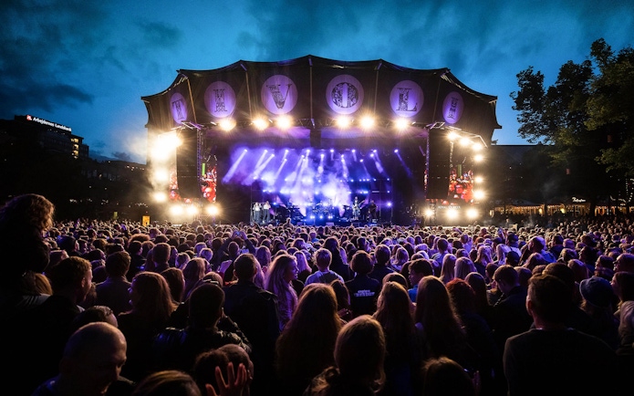 Crowd enjoying a live concert at Tivoli Gardens, Copenhagen.