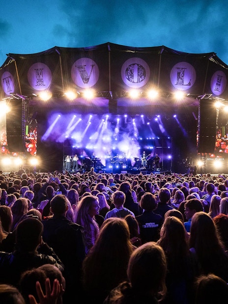 Crowd enjoying a live concert at Tivoli Gardens, Copenhagen.