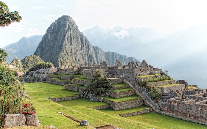 Machu Picchu ruins with Huayna Picchu mountain in the background, Peru.