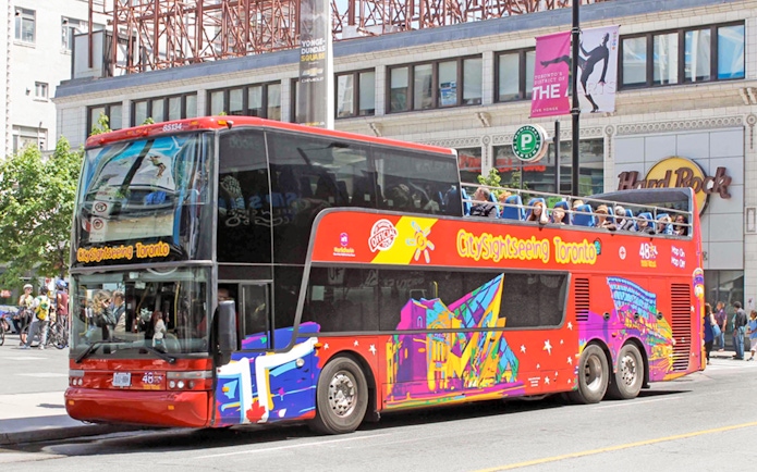 Open top Toronto Hop-On Hop-Off bus near Yonge-Dundas Square.