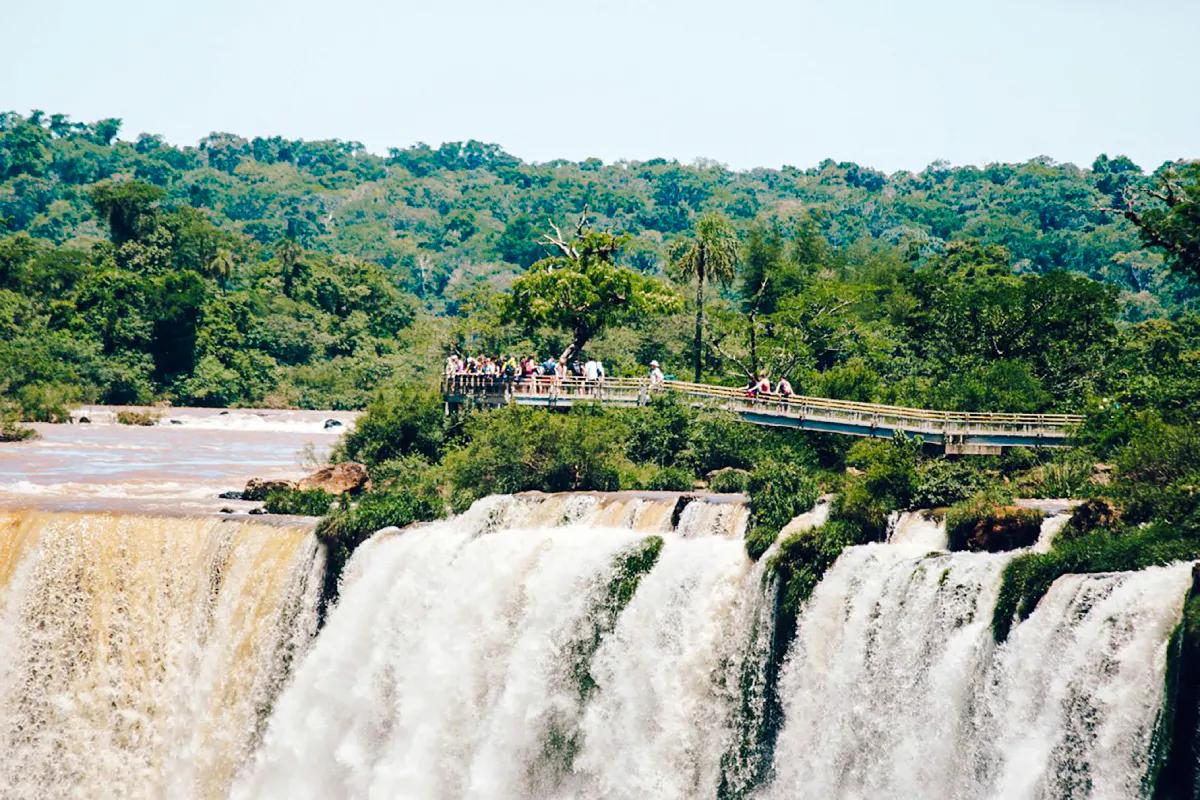Visitors on a walkway above Iguazu Falls, Foz do Iguaçu, Brazil.