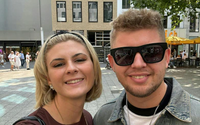 Selfie of two people in Cologne city center during a murder mystery exploration game.