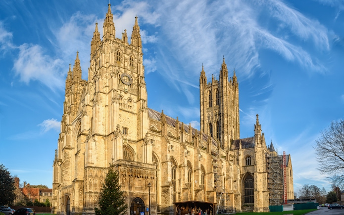 Canterbury Cathedral under a blue sky, part of the Canterbury and Dover Guided Day Tour from London.