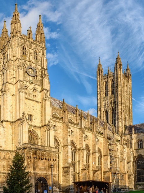 Canterbury Cathedral under a blue sky, part of the Canterbury and Dover Guided Day Tour from London.