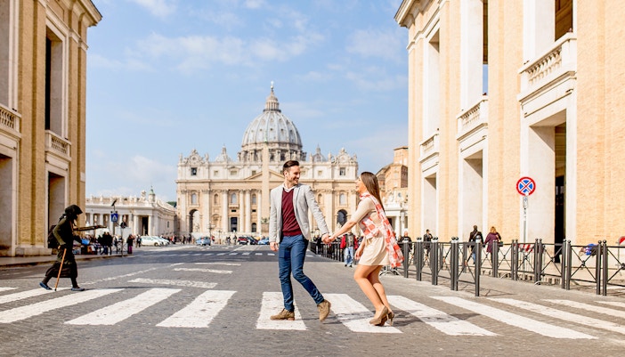 Couple enjoying a scenic view of the Colosseum in Rome.
