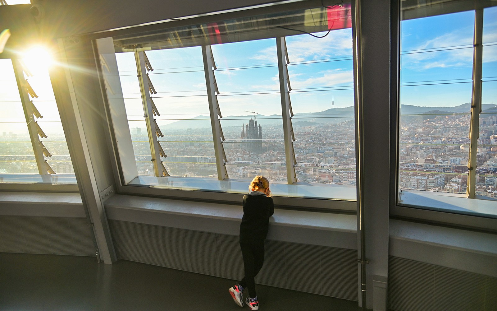 View of Barcelona skyline and Sagrada Familia from Torre Glories observation deck.