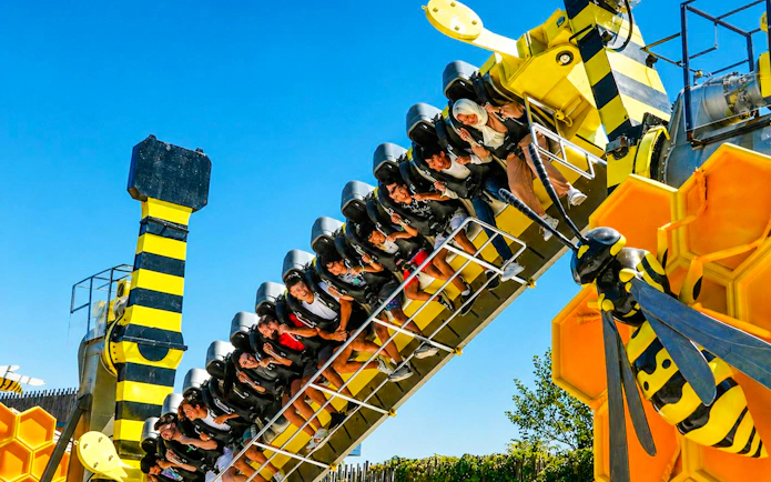 Guests on a bee-themed ride at Vialand Theme Park, Istanbul.
