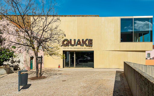Entrance to Quake Earthquake Museum in Lisbon with modern facade.