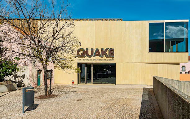 Entrance to Quake Earthquake Museum in Lisbon with modern facade.