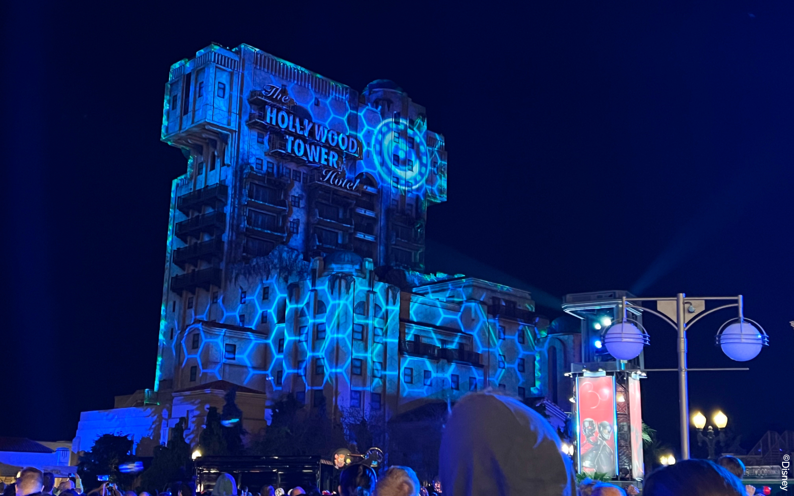 Disneyland Paris parade featuring characters in superhero costumes during Heroic Welcome show.